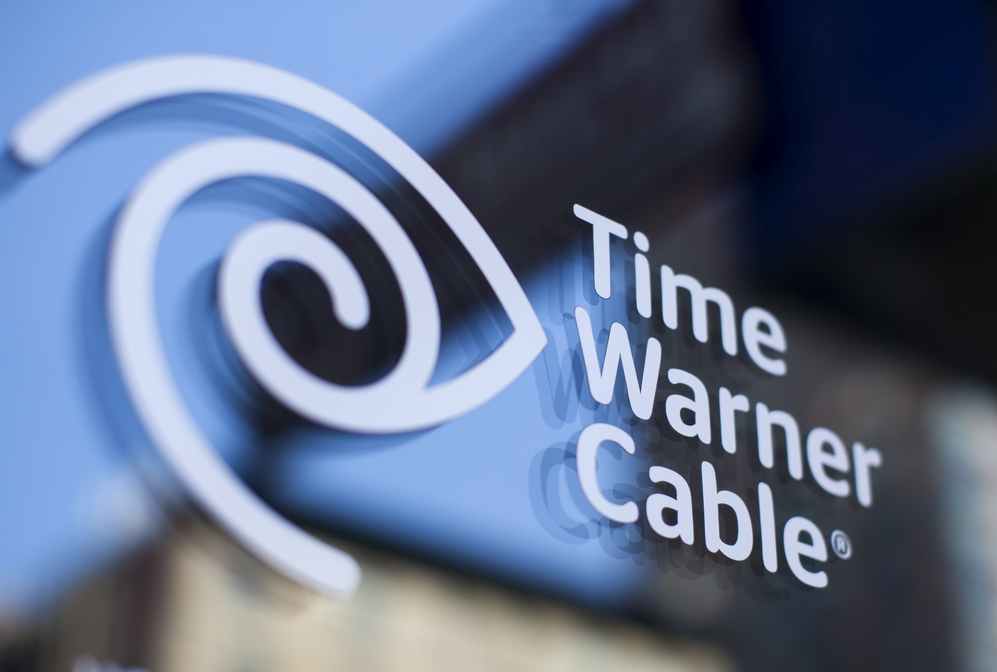 A Time Warner Cable sign and logo are seen on a Time Warner Cable store in the Manhattan borough of New York City, May 26, 2015. Charter Communications Inc, controlled by cable industry pioneer John Malone, offered to buy Time Warner Cable Inc for $56 billion, seeking to combine the No. 3 and No. 2 U.S. cable operators to compete against market leader Comcast Corp. REUTERS/Mike Segar